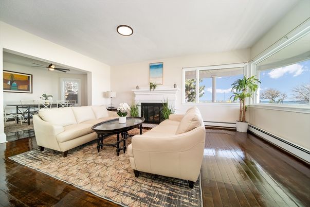 Dining room, Fireplace, Interior, Living room, Recessed Lighting, Water, Wood Texture Flooring