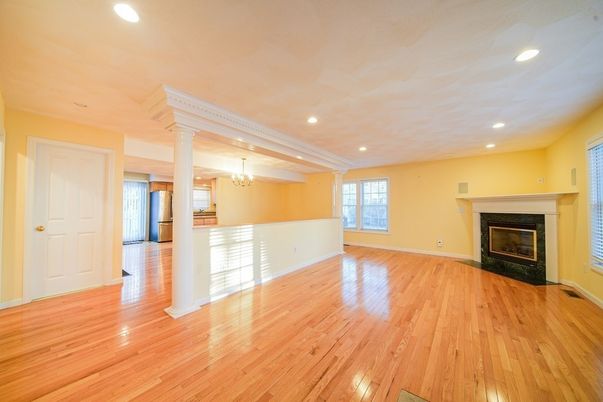 Chandelier, Empty room, Fireplace, Interior, Recessed Lighting, Wood Texture Flooring