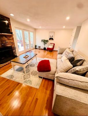 Fireplace, Interior, Living room, Recessed Lighting, Stone Walls, Wood Texture Flooring