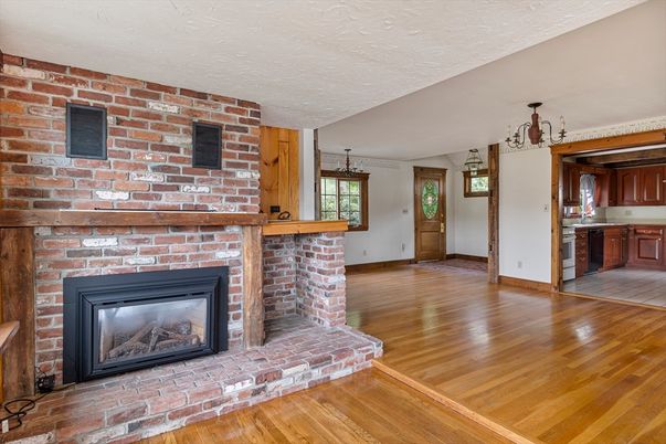 Empty room, Fireplace, Interior, Kitchen, Pendant Lights, Stone Walls, Wood Texture Flooring