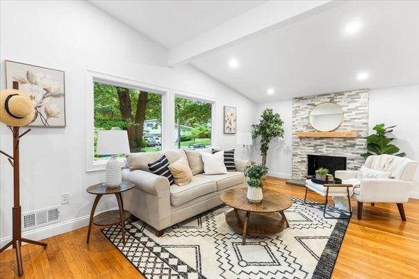Fireplace, Interior, Living room, Recessed Lighting, Stone Walls, Wood Texture Flooring