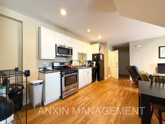 Interior, Kitchen, Recessed Lighting, Stainless Steel Appliances, Washer, Wood Texture Flooring