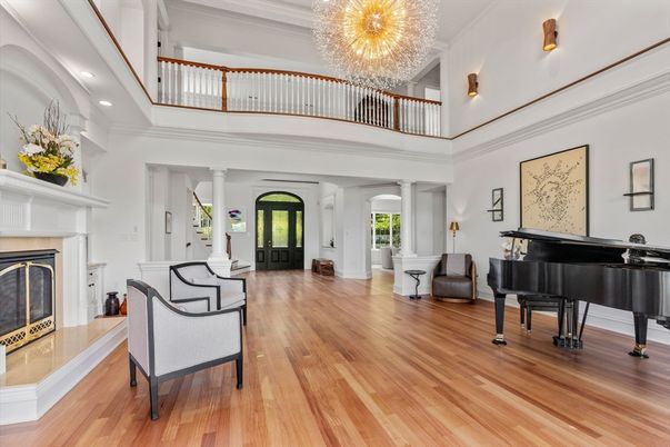 Chandelier, Fireplace, Interior, Piano, Recessed Lighting, Wood Texture Flooring