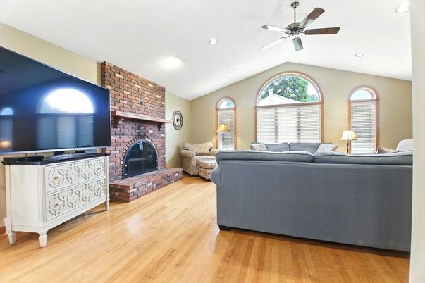 Fireplace, Interior, Living room, Recessed Lighting, Stone Walls, Wood Texture Flooring