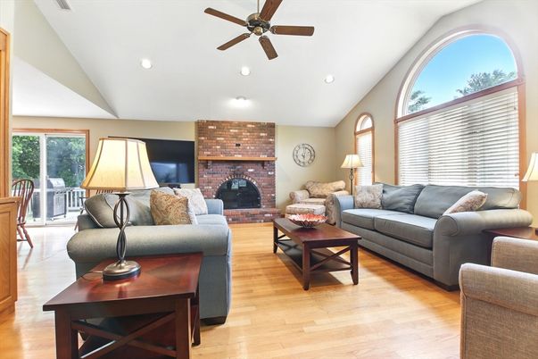 Fireplace, Interior, Living room, Recessed Lighting, Stone Walls, Wood Texture Flooring