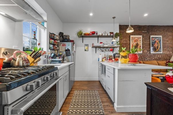 Interior, Kitchen, Pendant Lights, Recessed Lighting, Stainless Steel Appliances, Stone Walls, Wood Texture Flooring
