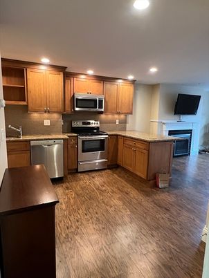 Fireplace, Interior, Kitchen, Recessed Lighting, Stainless Steel Appliances, Wood Texture Flooring