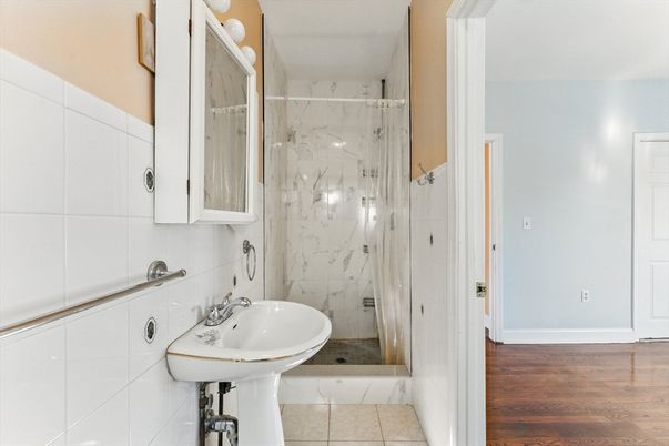 Bathroom, Glass Shower, Interior, Marble Walls, Wood Texture Flooring