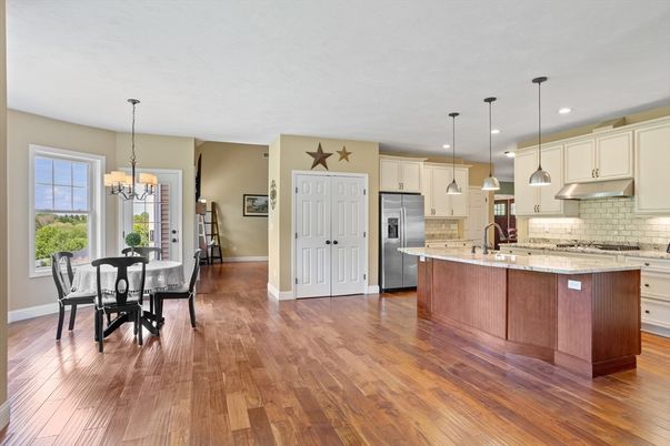 Chandelier, Dining room, Interior, Kitchen, Pendant Lights, Recessed Lighting, Stainless Steel Appliances, Wood Texture Flooring