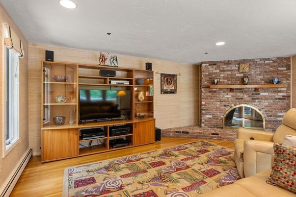Fireplace, Interior, Living room, Recessed Lighting, Stone Walls, Wood Texture Flooring