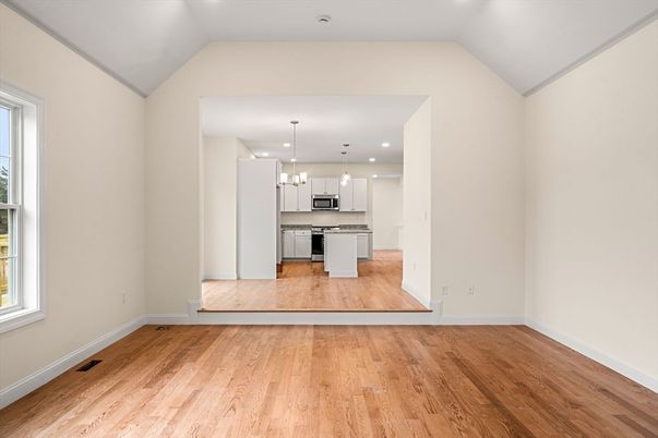 Empty room, Interior, Kitchen, Pendant Lights, Recessed Lighting, Stainless Steel Appliances, Wood Texture Flooring