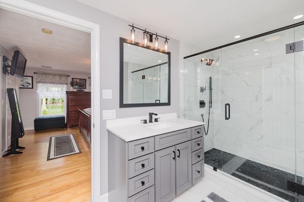 Bathroom, Glass Shower, Interior, Marble Walls, Recessed Lighting, Wood Texture Flooring
