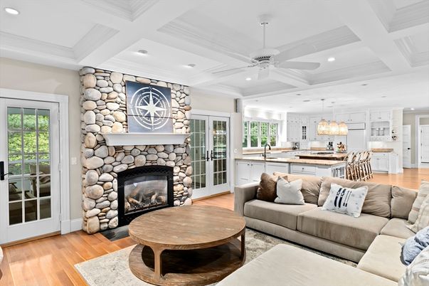 Chandelier, Fireplace, Interior, Kitchen, Living room, Pendant Lights, Recessed Lighting, Stone Walls, Wood Texture Flooring
