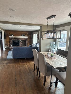 Dining room, Fireplace, Interior, Living room, Pendant Lights, Stone Walls, Wood Texture Flooring