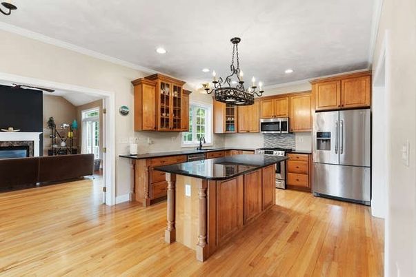 Chandelier, Fireplace, Interior, Kitchen, Recessed Lighting, Stainless Steel Appliances, Wood Texture Flooring