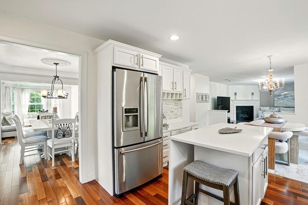 Chandelier, Dining room, Fireplace, Interior, Kitchen, Pendant Lights, Recessed Lighting, Stainless Steel Appliances, Wood Texture Flooring