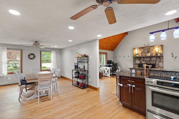Dining room, Fireplace, Interior, Kitchen, Recessed Lighting, Stainless Steel Appliances, Wooden Ceilings, Wood Texture Flooring