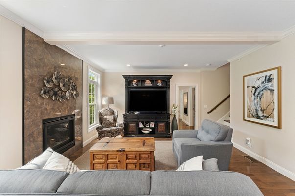 Fireplace, Interior, Living room, Recessed Lighting, Stone Walls, Wood Texture Flooring