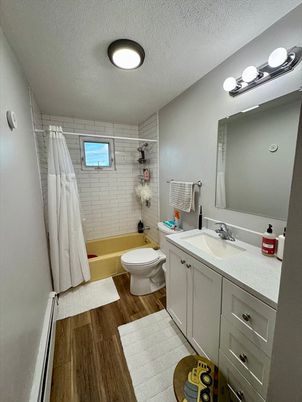 Bathroom, Dual Sink Vanities, Interior, Recessed Lighting, Wood Texture Flooring