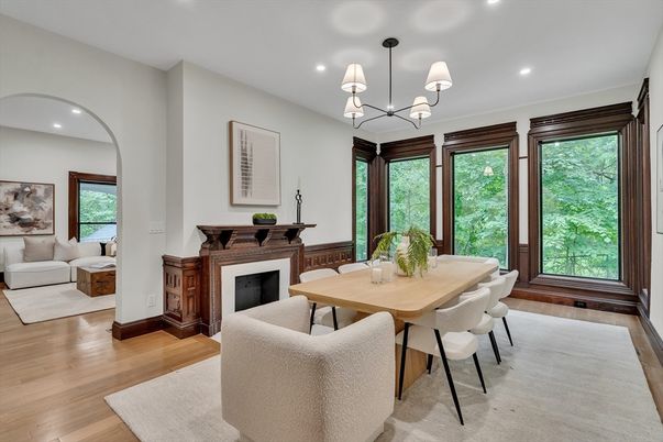 Chandelier, Dining room, Fireplace, Interior, Living room, Pendant Lights, Recessed Lighting, Wood Texture Flooring