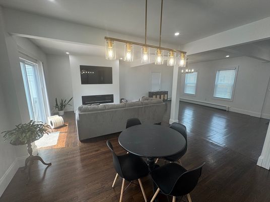 Dining room, Fireplace, Interior, Living room, Pendant Lights, Recessed Lighting, Wood Texture Flooring