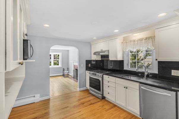 Fireplace, Interior, Kitchen, Recessed Lighting, Stainless Steel Appliances, Wood Texture Flooring