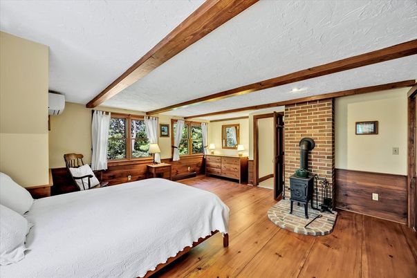 Bedroom, Fireplace, Interior, Recessed Lighting, Stone Walls, Wooden Beams, Wood Texture Flooring