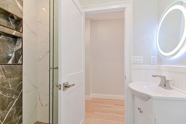 Bathroom, Glass Shower, Interior, Marble Walls, Wood Texture Flooring
