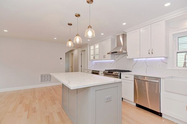 Interior, Kitchen, Marble Walls, Pendant Lights, Recessed Lighting, Stainless Steel Appliances, Wood Texture Flooring