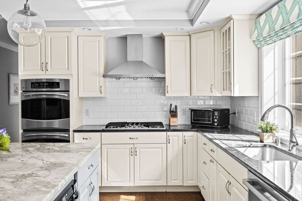 Interior, Kitchen, Recessed Lighting, Stainless Steel Appliances, Tile Countertops, Wood Texture Flooring