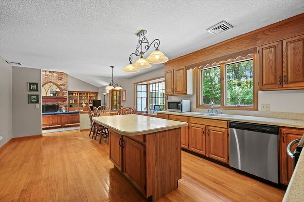 Dining room, Fireplace, Interior, Kitchen, Pendant Lights, Stone Walls, Wood Texture Flooring