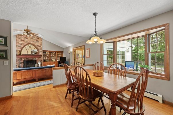 Dining room, Fireplace, Interior, Pendant Lights, Stone Walls, Wood Texture Flooring