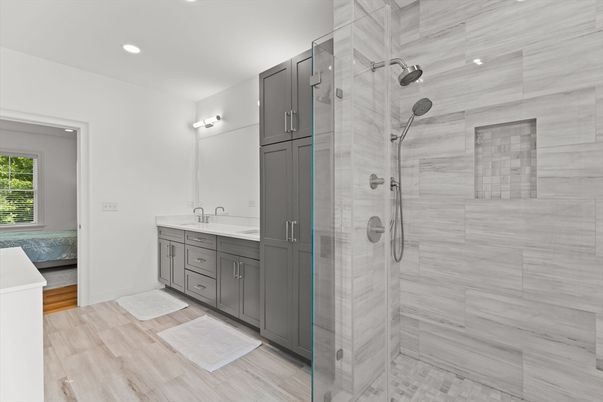Bathroom, Dual Sink Vanities, Glass Shower, Interior, Recessed Lighting, Wood Texture Flooring