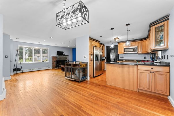 Dining room, Fireplace, Interior, Kitchen, Pendant Lights, Recessed Lighting, Stainless Steel Appliances, Wood Texture Flooring
