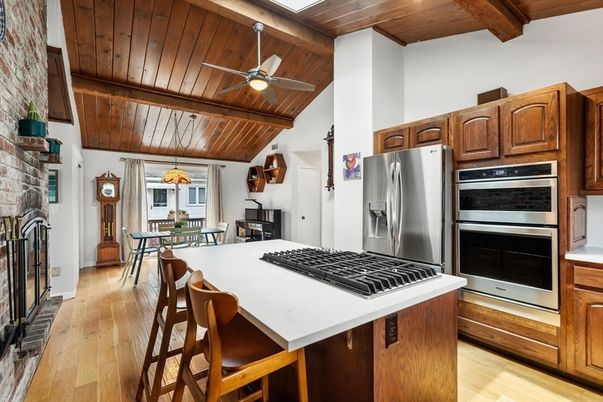 Dining room, Fireplace, Interior, Kitchen, Stainless Steel Appliances, Wooden Beams, Wooden Ceilings, Wood Texture Flooring