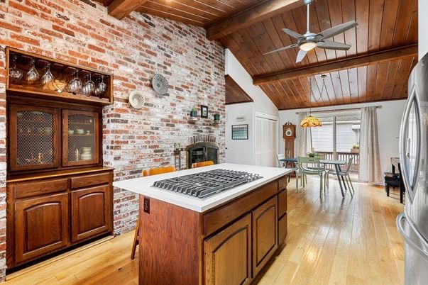 Chandelier, Dining room, Fireplace, Interior, Kitchen, Pendant Lights, Stone Walls, Wooden Beams, Wooden Ceilings, Wood Texture Flooring
