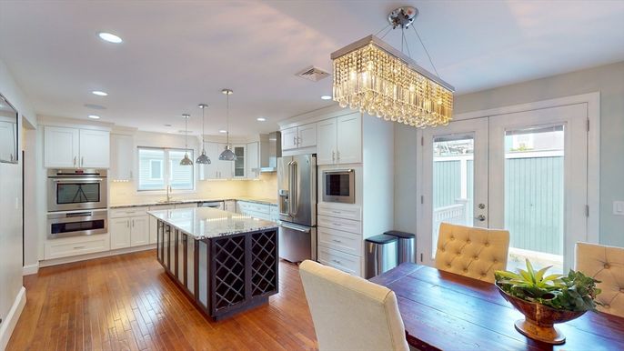 Chandelier, Dining room, Interior, Kitchen, Pendant Lights, Recessed Lighting, Stainless Steel Appliances, Wood Texture Flooring