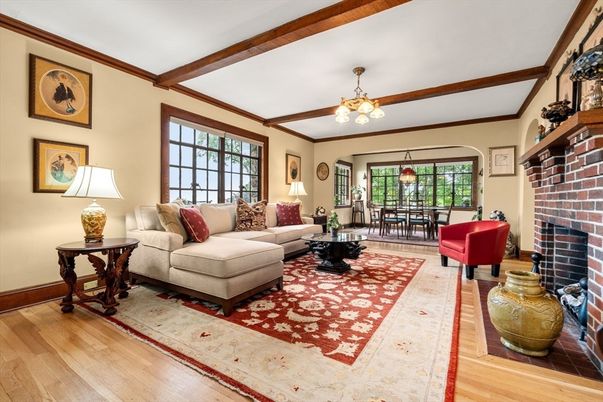 Chandelier, Dining room, Fireplace, Interior, Living room, Pendant Lights, Stone Walls, Wooden Beams, Wood Texture Flooring