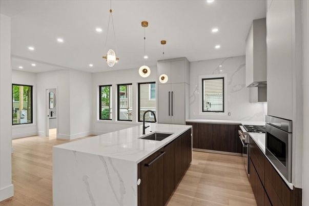 Interior, Kitchen, Marble Walls, Pendant Lights, Recessed Lighting, Stainless Steel Appliances, Wood Texture Flooring