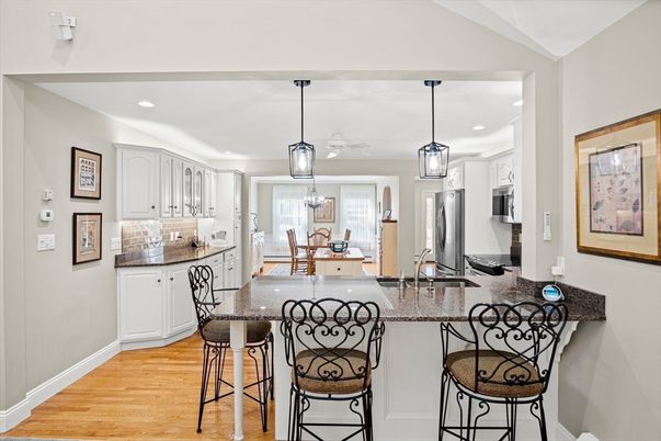 Dining room, Interior, Kitchen, Pendant Lights, Recessed Lighting, Stainless Steel Appliances, Wood Texture Flooring
