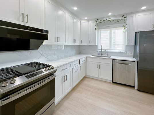 Interior, Kitchen, Marble Walls, Recessed Lighting, Stainless Steel Appliances, Wood Texture Flooring