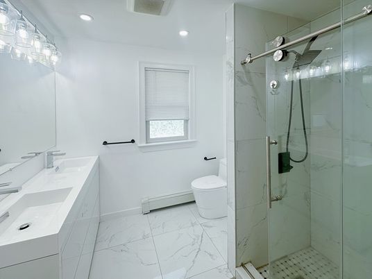 Bathroom, Dual Sink Vanities, Glass Shower, Interior, Marble, Marble Walls, Recessed Lighting
