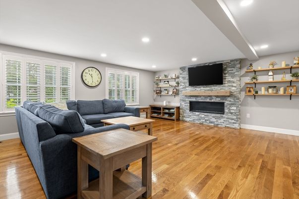 Fireplace, Interior, Living room, Recessed Lighting, Stone Walls, Wood Texture Flooring