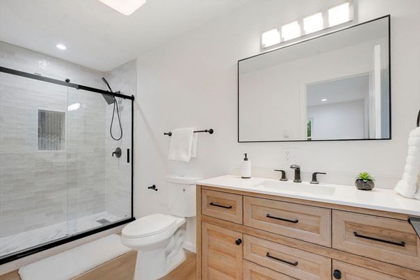 Bathroom, Dual Sink Vanities, Glass Shower, Interior, Recessed Lighting, Wood Texture Flooring