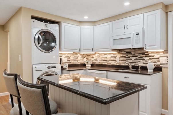 Interior, Kitchen, Recessed Lighting, Washer, Wood Texture Flooring