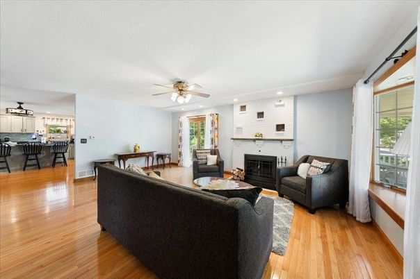 Fireplace, Interior, Living room, Recessed Lighting, Stone Walls, Wood Texture Flooring