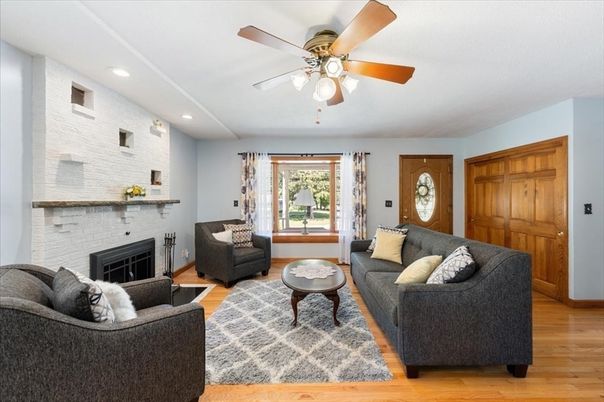 Fireplace, Interior, Living room, Recessed Lighting, Stone Walls, Wood Texture Flooring