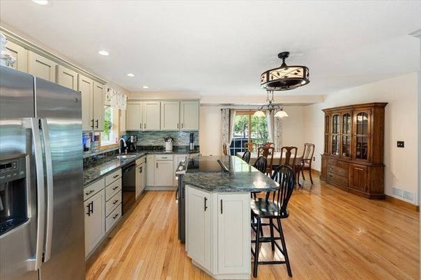 Dining room, Interior, Kitchen, Pendant Lights, Recessed Lighting, Stainless Steel Appliances, Wood Texture Flooring