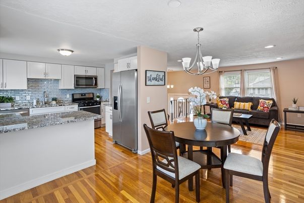 Chandelier, Dining room, Interior, Kitchen, Living room, Recessed Lighting, Stainless Steel Appliances, Wood Texture Flooring