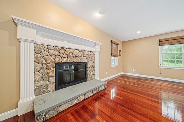 Empty room, Fireplace, Interior, Recessed Lighting, Stone Walls, Wood Texture Flooring